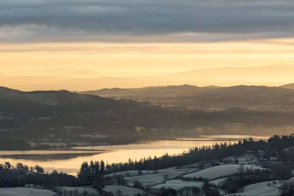 Lake District photography. A very dramatic golden hour looking across Windermere towards Ambleside. Photographed with a Canon 24-70 F2.8L lens.