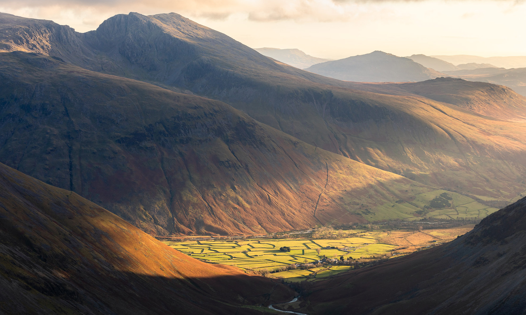 A breathtaking landscape photograph of Mosedale Valley and Wasdale Head during sunset in the Lake District.