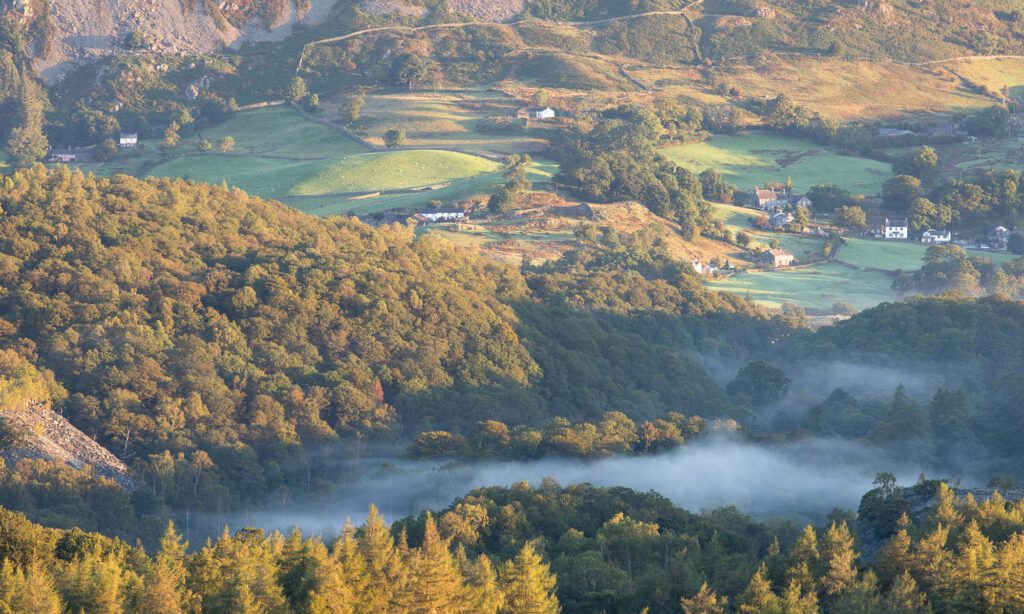 Lake District landscape photography. An early autumnal morning resulted in a very atmospheric scene landscape photographers dream of. Dynamic patches of wispy mist worked their way through the valley which was illuminated beautifully by the delicate early morning sun. Photographed with a Canon 70-200mm F4L lens.