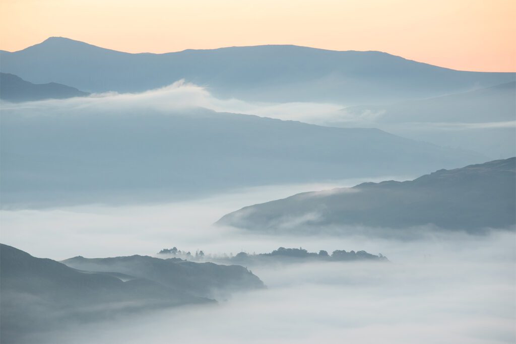 Lake District landscape photograph of a temperature inversion along Great Langdale Valley at sunrise.