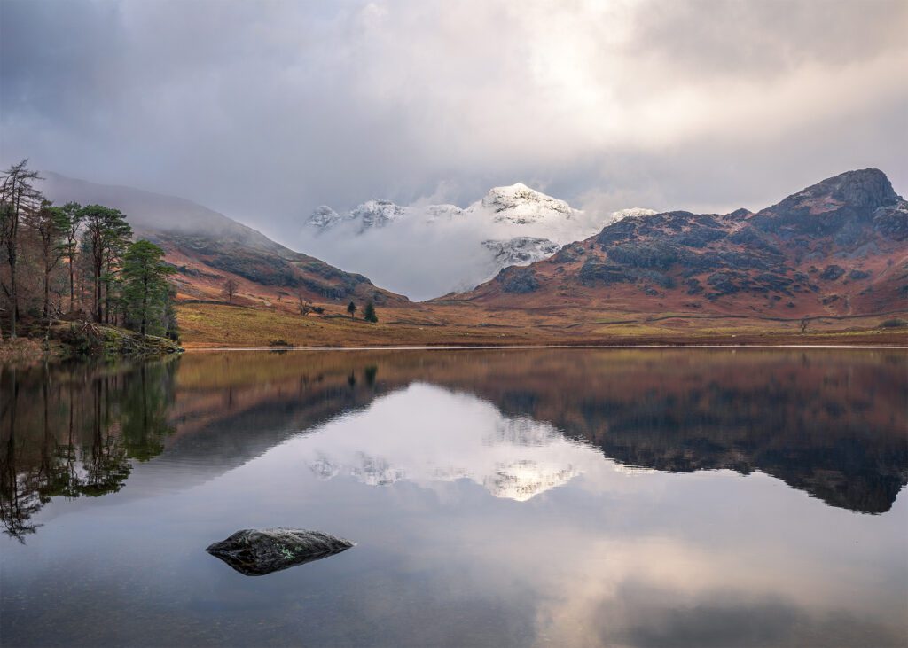 Dramatic landscape photography at Blea Tarn in the Lake District during a cold winter morning.