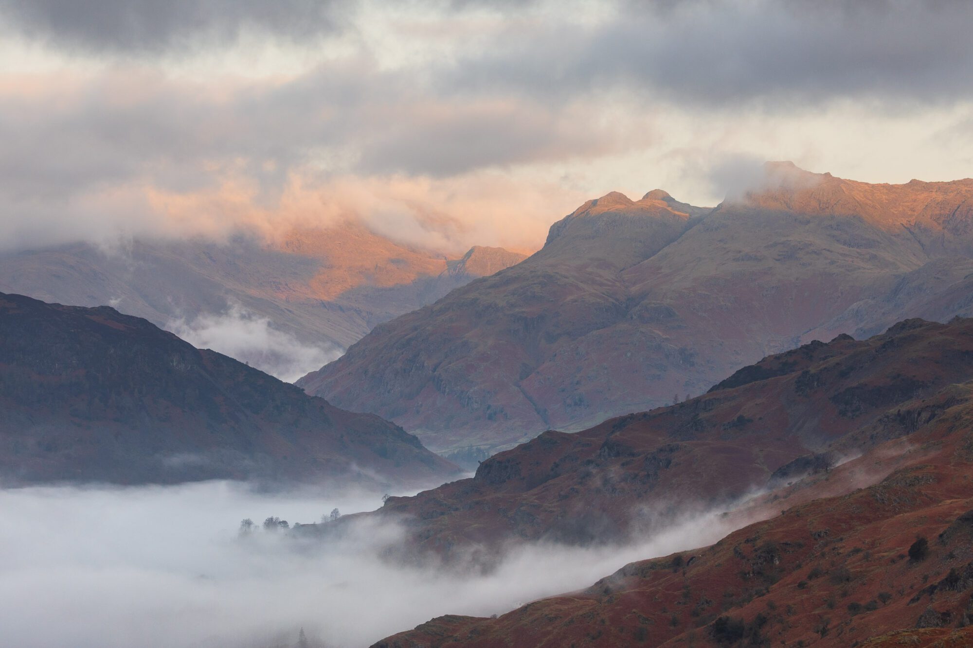 Lake District landscape photography featuring the Langdale Pikes during a beautiful spring sunrise.