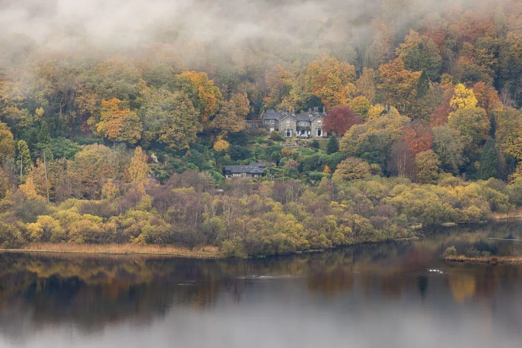 A classic view of Grasmere from Loughrigg Fell on a calm autumn morning.
