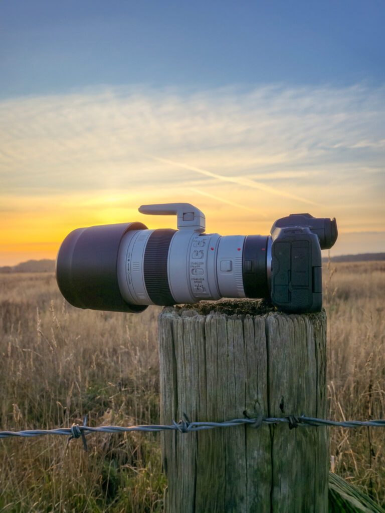 Canon EF 100-400mm f/4.5-5.6L IS II USM on a wooden post at Sunset.