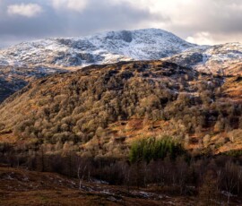 A landscape shot of Wetherlam in the Lake District covered in snow.