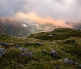 Mickelden Valley Summer landscape photography from Bowfell in the Lake District during a breathtaking summer morning. Low cloud hovers above Mickleden Valley catching the glorious sunrise light around Great Langdale.