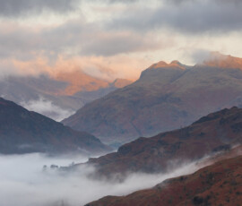 Loughrigg's Finest Lake District landscape photography featuring the Langdale Pikes during a beautiful spring sunrise.