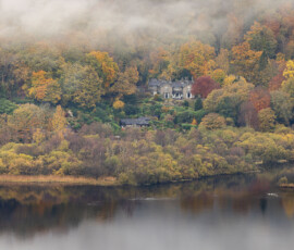 A classic view of Grasmere from Loughrigg Fell on a calm autumn morning.