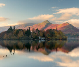 A view of Catbells during an autumn sunrise at Crow Park on Derwentwater, Keswick.